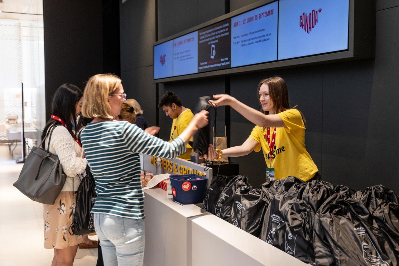 Guest being greeted at a registration desk